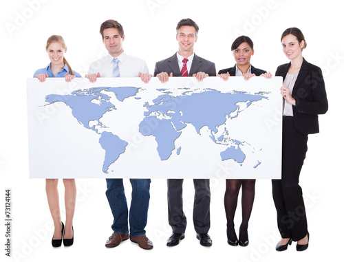 Portrait Of Confident Businesspeople Holding Worldmap