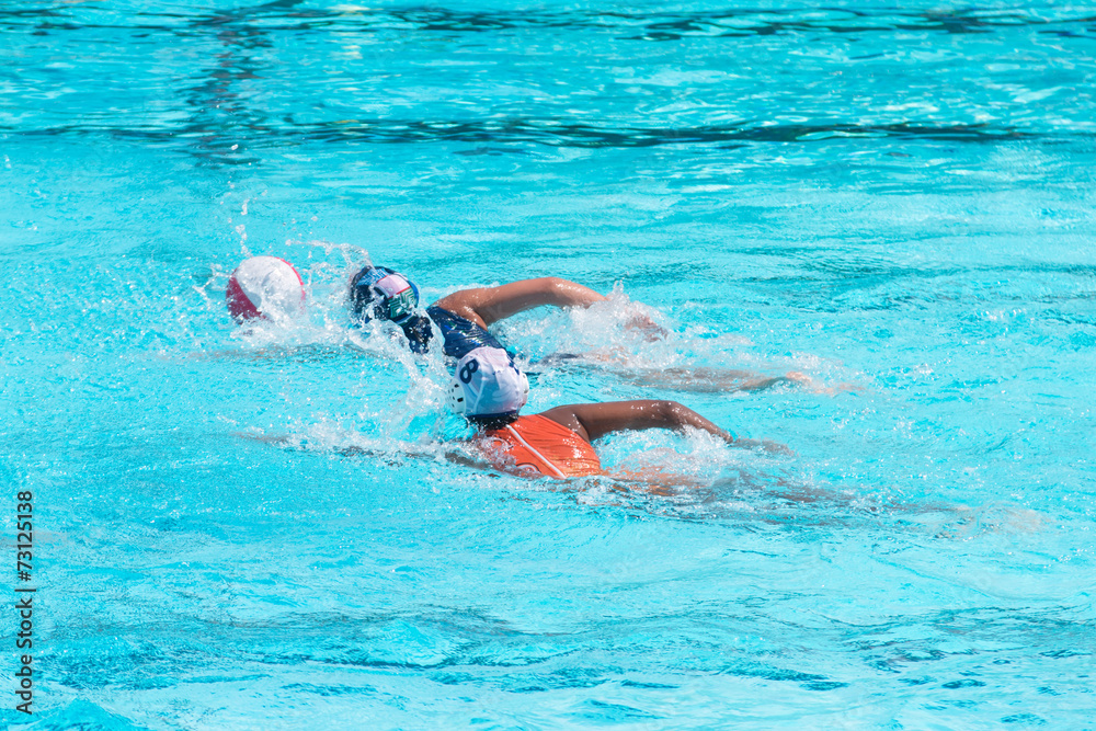 Water polo players in competition
