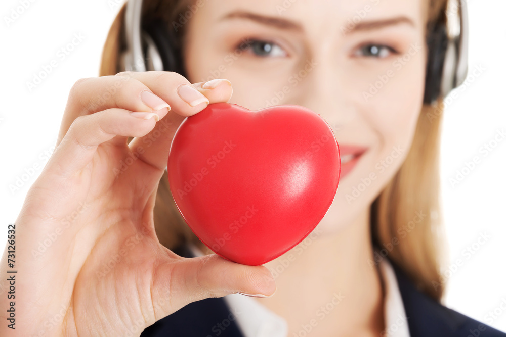 Call center woman holding heart
