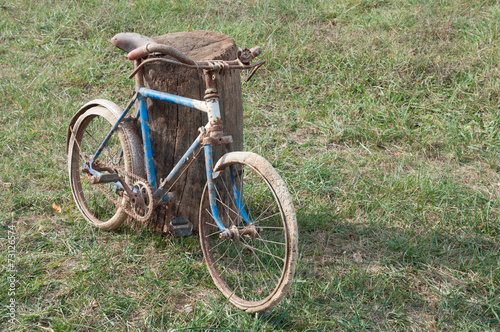 Antique or retro rusty bicycles outside. Child bike