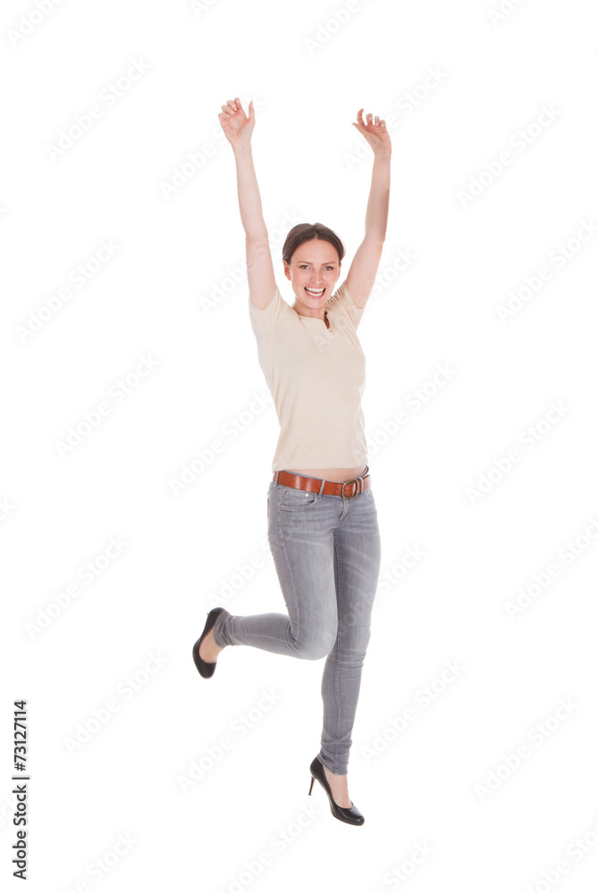 Excited Woman Dancing Against White Background