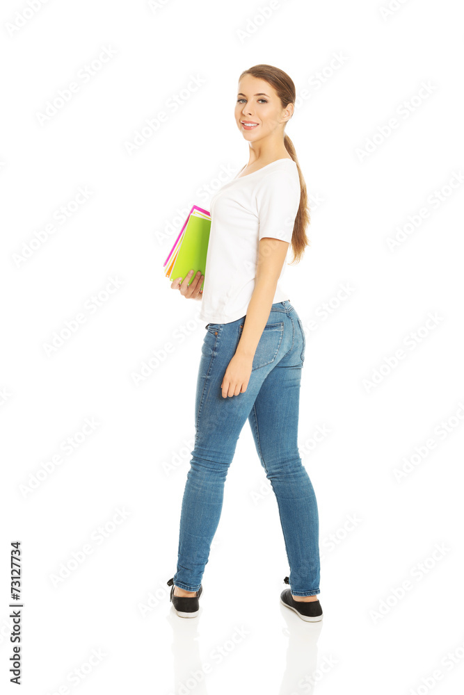 Woman holding notebooks Woman holding notebooks