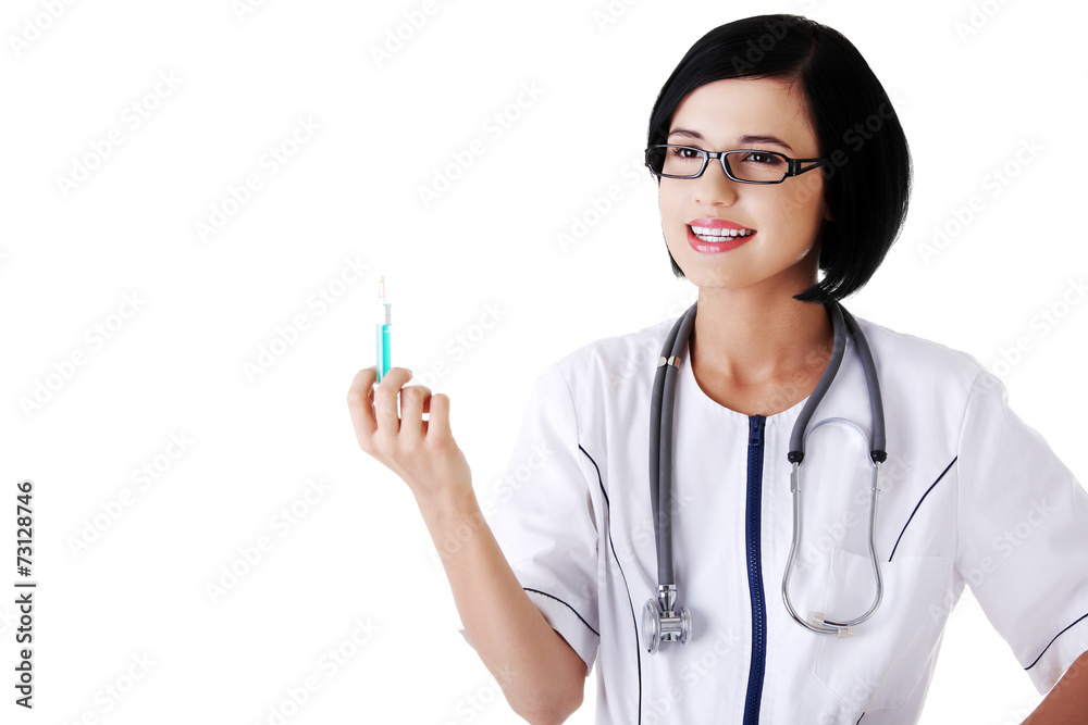 Female doctor holding a syringe Female doctor holding a syringe