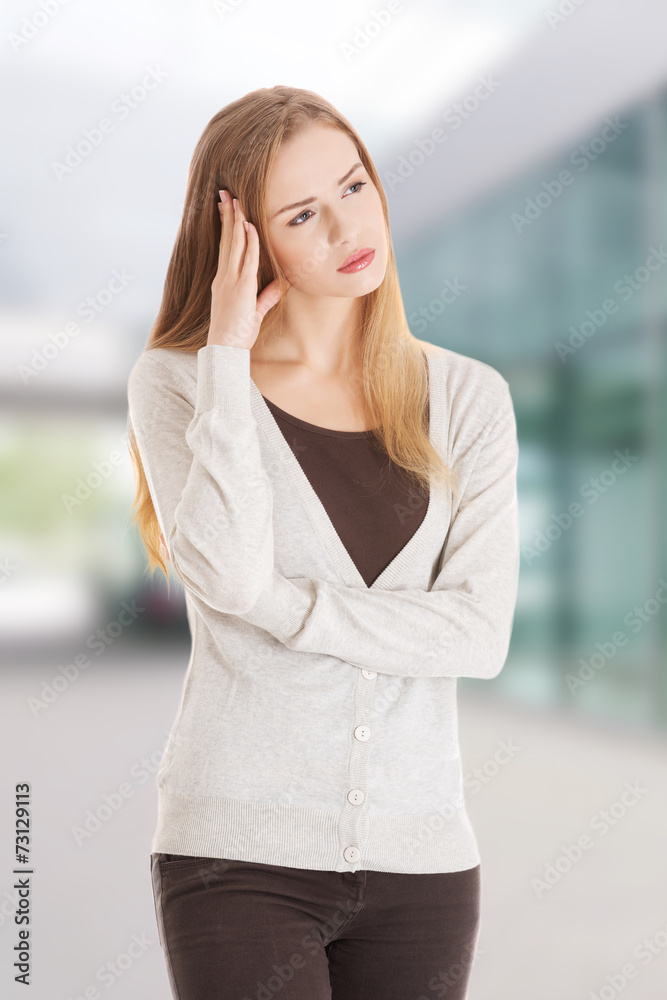 Beautiful casual woman looks worried. Beautiful casual woman looks worried.