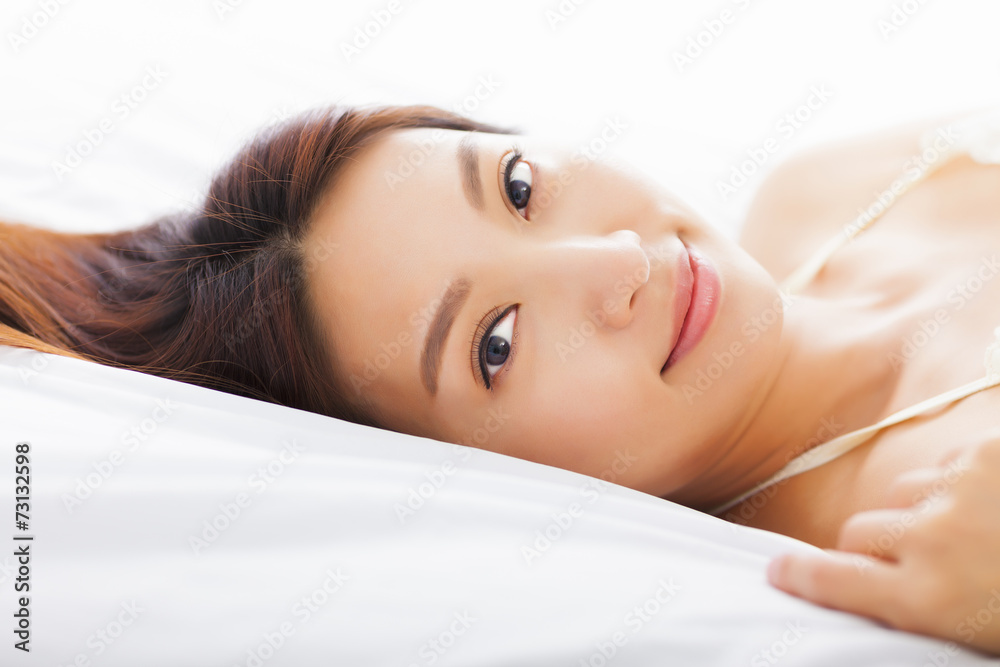Obraz premium young Beautiful woman relaxing on the bed