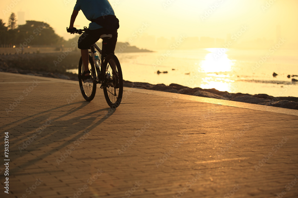 cycling at sunrise seaside 