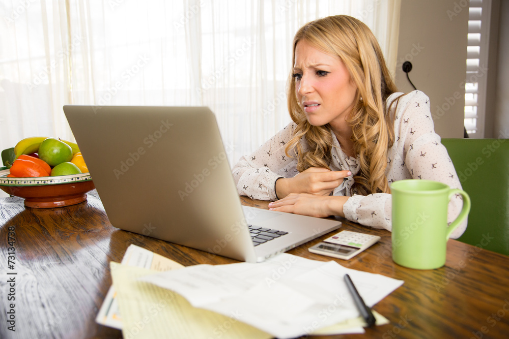 Surprised woman reading bad news Surprised woman reading bad news