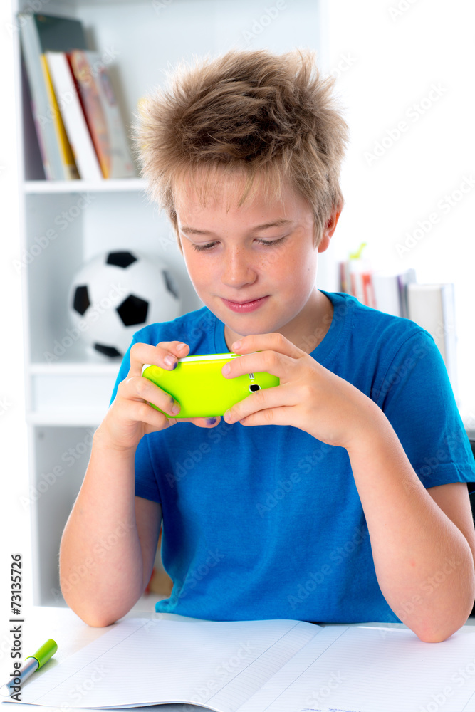 boy is using his smartphone boy is using his smartphone