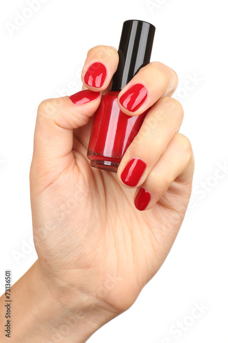 Nail polish in hand, close-up