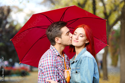 Loving couple under an umbr...