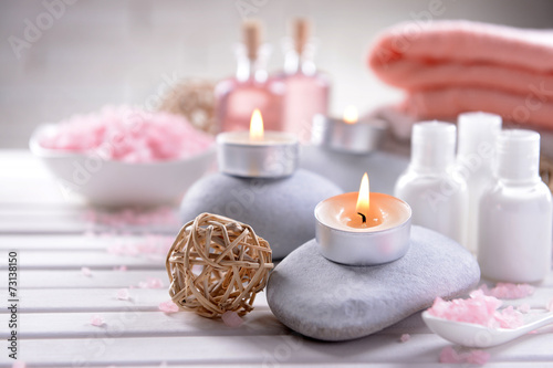Composition of spa treatment on table on white background