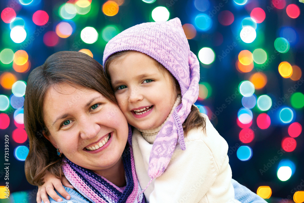 Obraz premium Happy family hugging the Christmas holidays