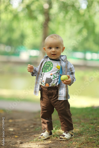 little boy in summer park