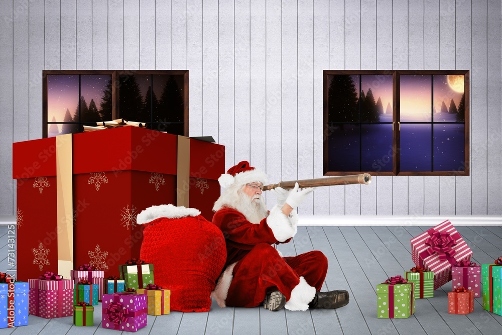 Obraz premium Composite image of santa looking through a telescope