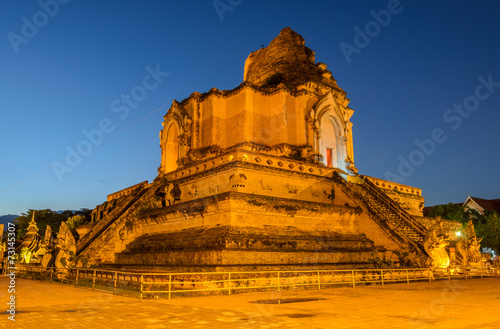 Ancient pagoda of Wat Chedi Luang temple at twilight in Chiang M