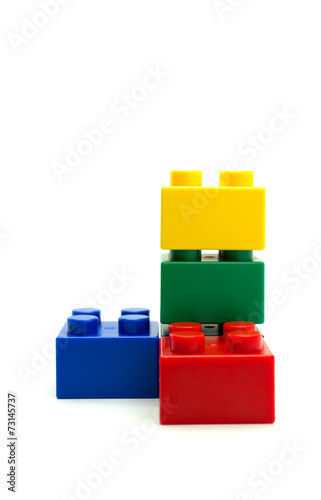 Plastic building blocks on white background