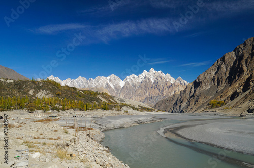 Tupopdan peaks and small river in Northern  Pakistan. photo