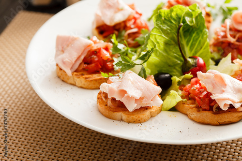 Bruschetta with tomato and ham