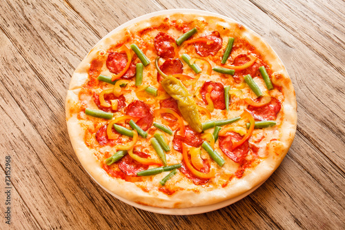 pizza on wooden background