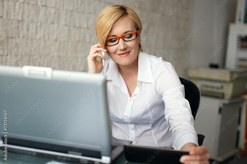 Young blonde businesswoman call in office Young blonde businesswoman call in office