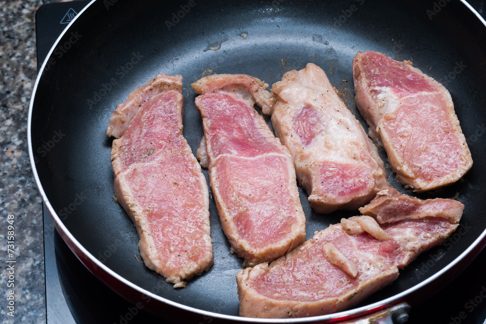 Raw sliced pork grill on the pan Raw sliced pork grill on the pan
