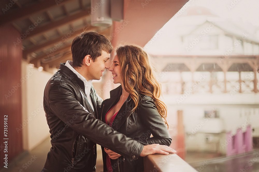 Loving couple embraces and laughs merrily Loving couple embraces and laughs merrily
