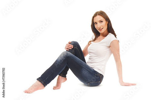 Young girl sitting on the floor