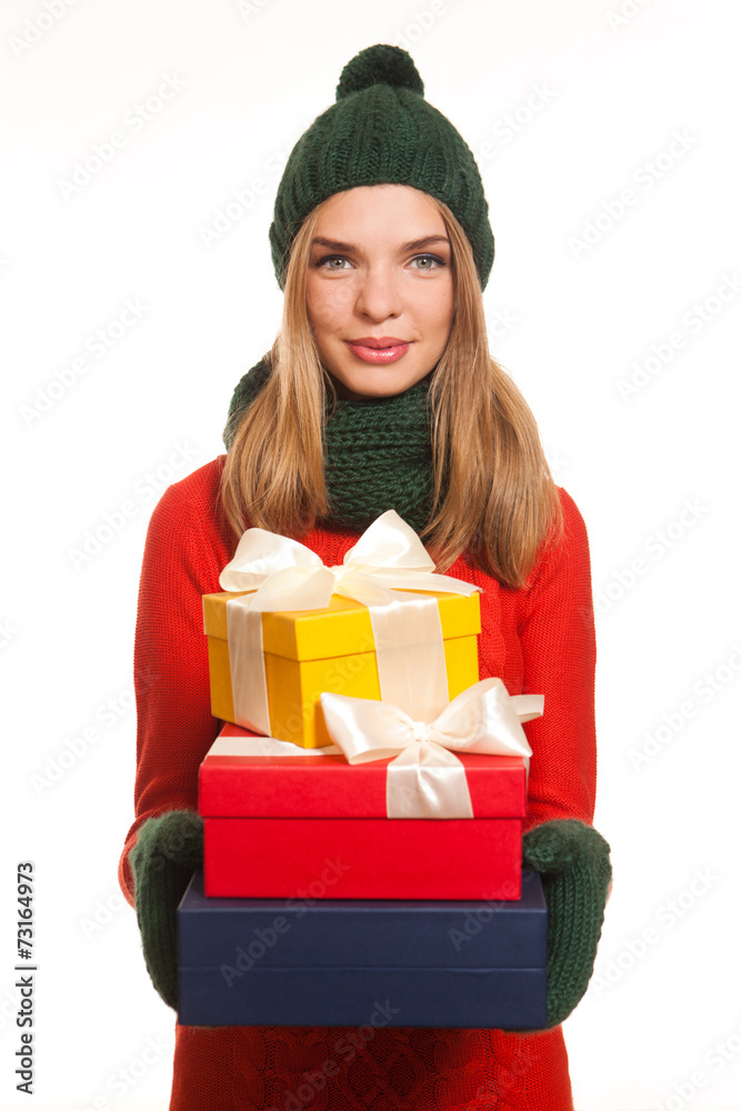 Model in the red dress posing with gift boxes Model in the red dress posing with gift boxes