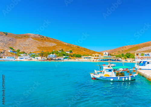 fishing boats at the port of Pserimos island in Greece