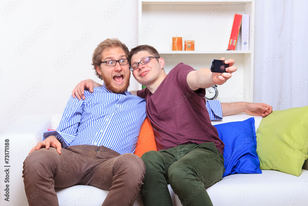 Two friends doing selfie on the sofa