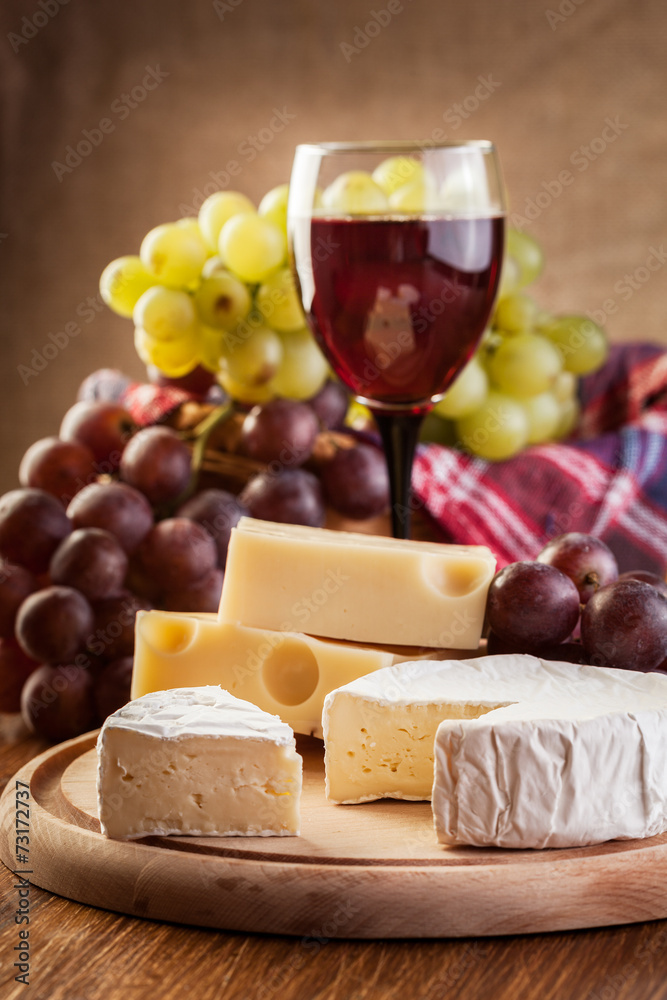 Cheese with a bottle and glasses of red wine Cheese with a bottle and glasses of red wine