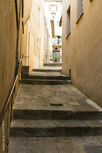 Narrow stone street in a town from Tuscany © bonciutoma