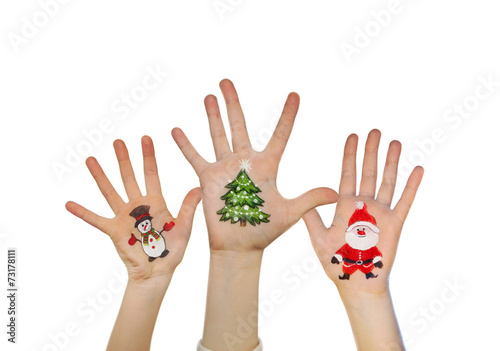 Children's hands raising up with painted Christmas symbols: Sant