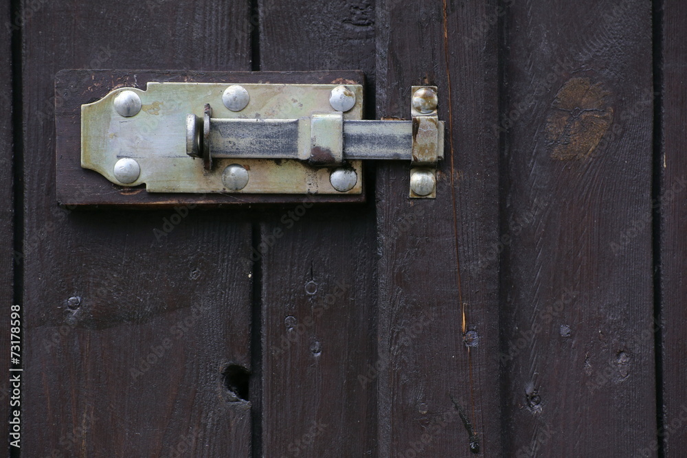 Door latch hanging at the outside of a gate Door latch hanging at the outside of a gate