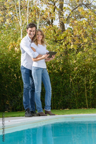 Attractive couple with tablet