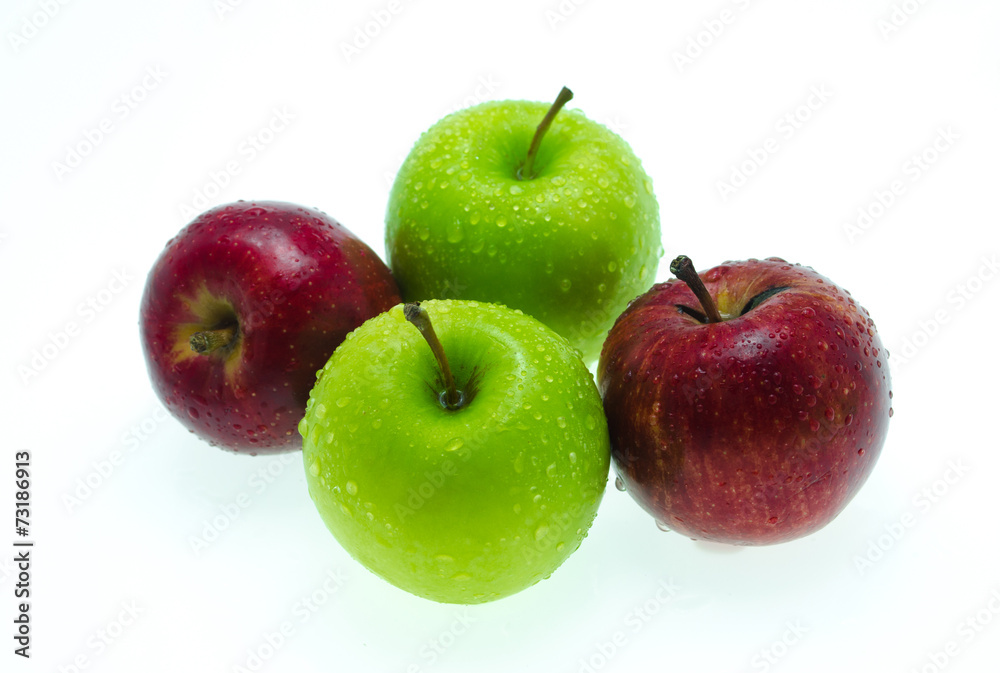 a red apple among green ones with drops of water a red apple among green ones with drops of water