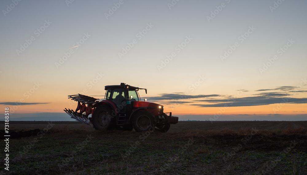 Naklejka premium Tractor plowing