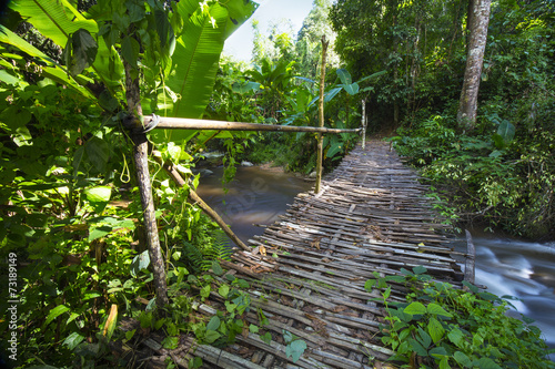 Wooden bridge cross the waterfalls  Lampang  Thailand