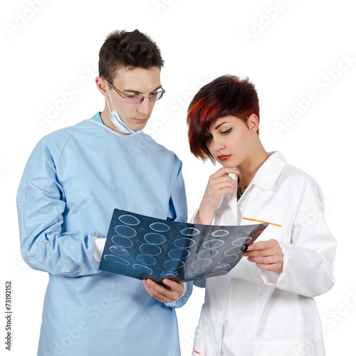 Two young doctor looking at tomography result. Isolated on white