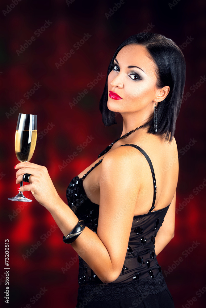Beautiful black hair woman holding glass of champagne