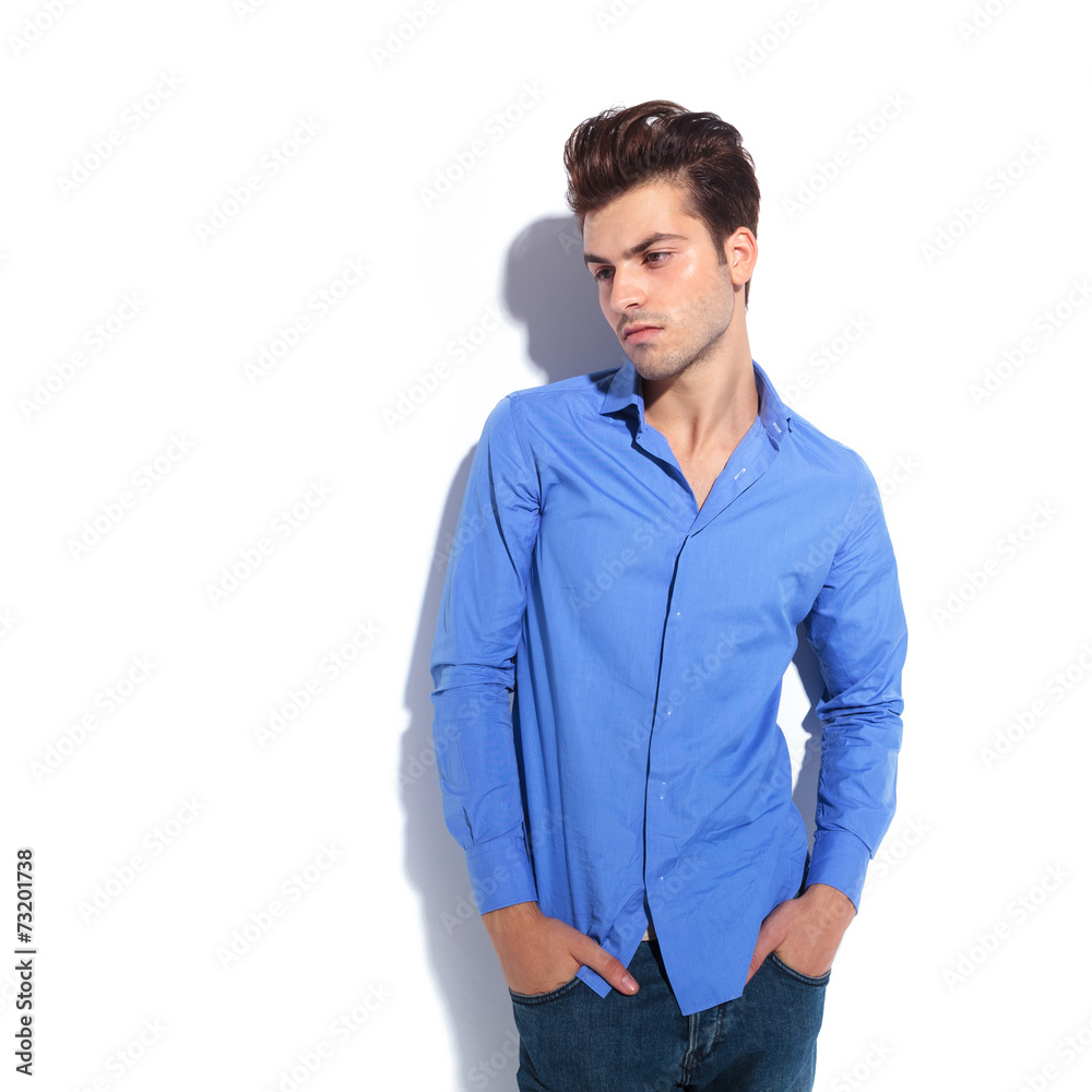 man looking down with his hands in pockets man looking down with his hands in pockets