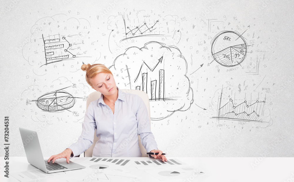 Business woman sitting at table with hand drawn graph charts Business woman sitting at table with hand drawn graph charts