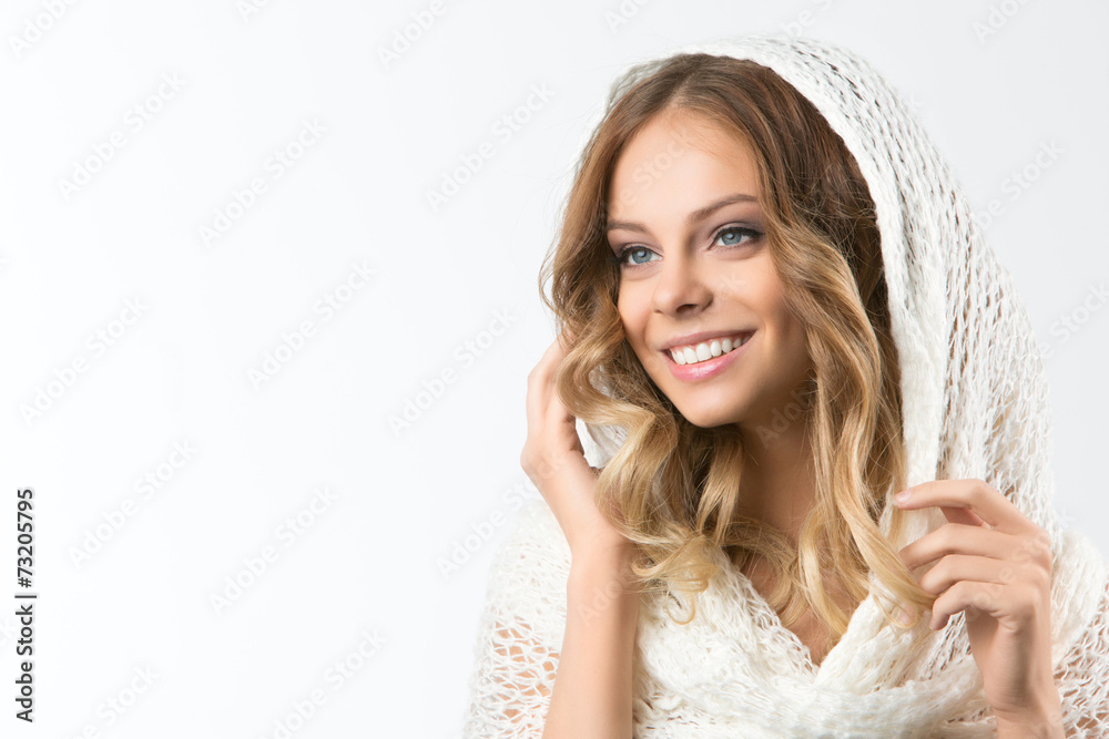 Portrait of a beautiful girl in a white sweater and scarf Portrait of a beautiful girl in a white sweater and scarf