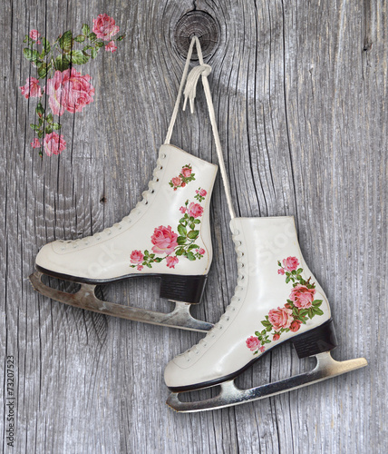 Pair of White Ice Skates with vintage roses decoration - backrou photo