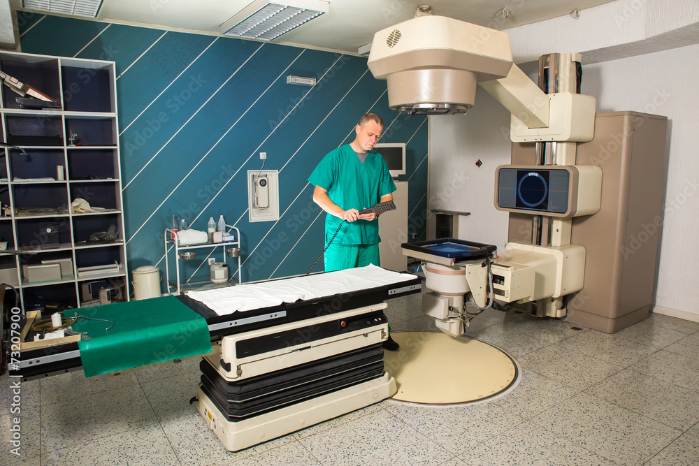 Radiotherapy room Radiation therapy machine Male radiologist Stock
