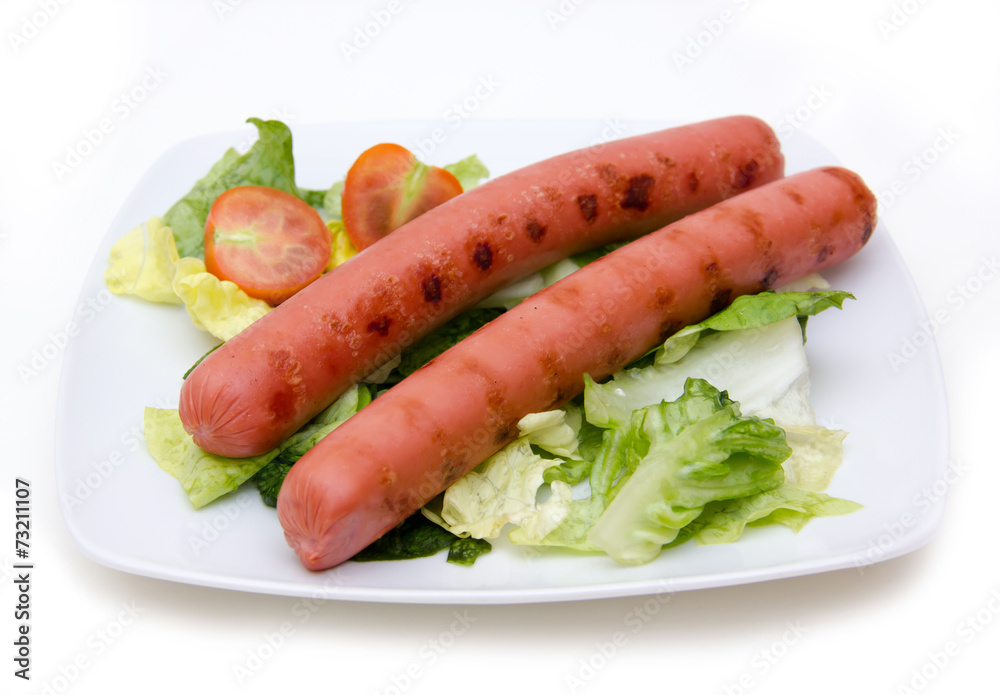 Sausages with salad on plate on white background Sausages with salad on plate on white background