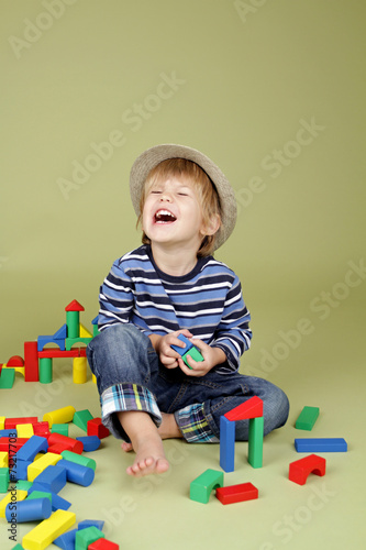 Child Playing with Blocks, Laughing, Fashion and Clothing photo