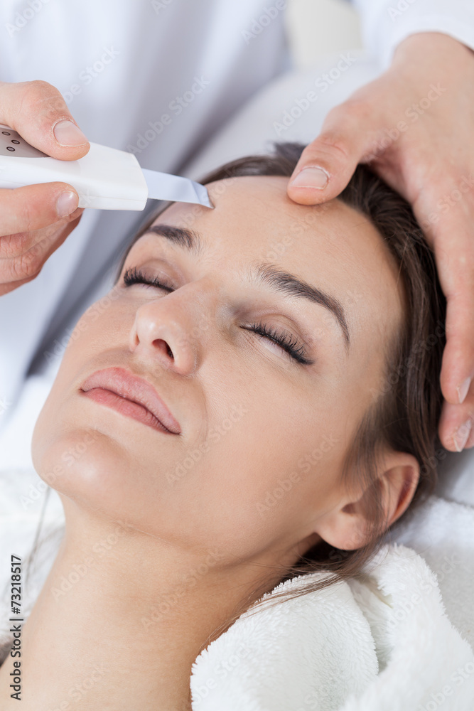 Relaxed woman during cavitation peeling