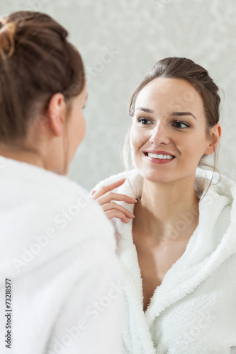 Satisfied woman after facial treatment