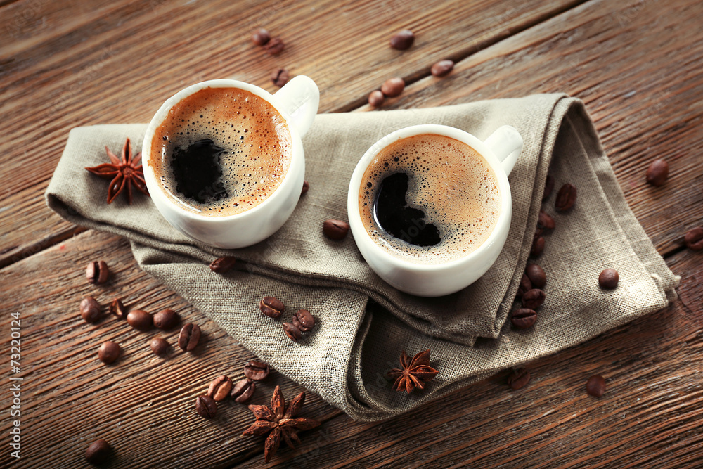 Two cups of coffee on wooden table - obrazy, fototapety, plakaty 